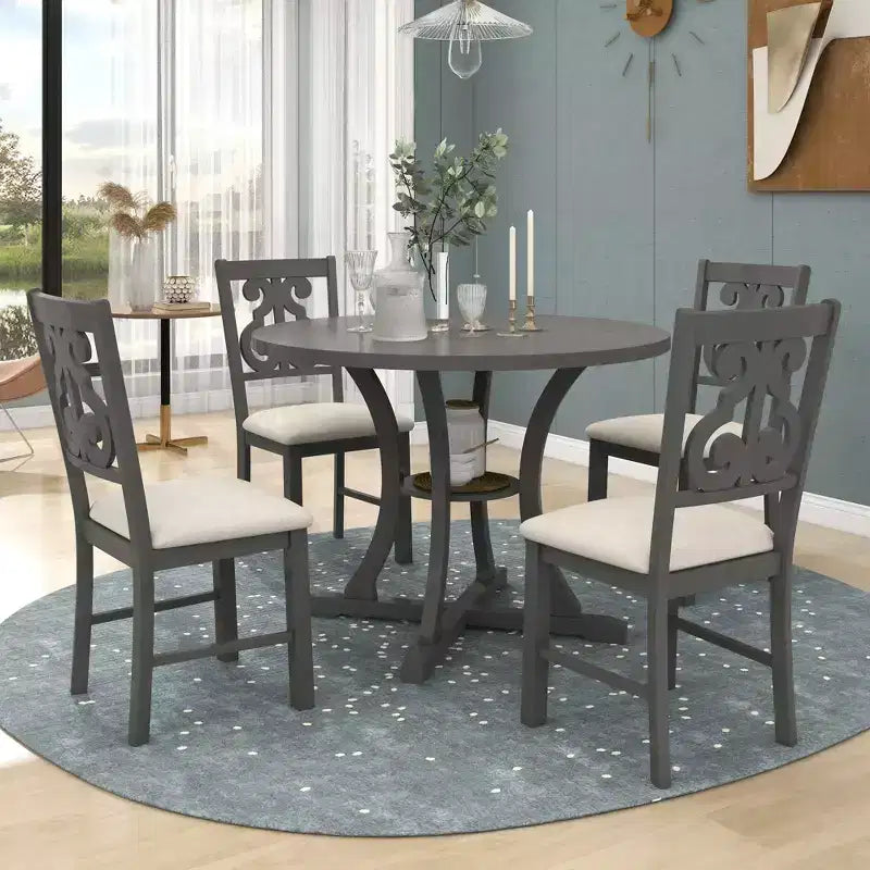 Ensemble de salle à manger rond 5 pièces en bois avec pieds de forme spéciale et dossier de chaise évidé au design exquis pour la cuisine