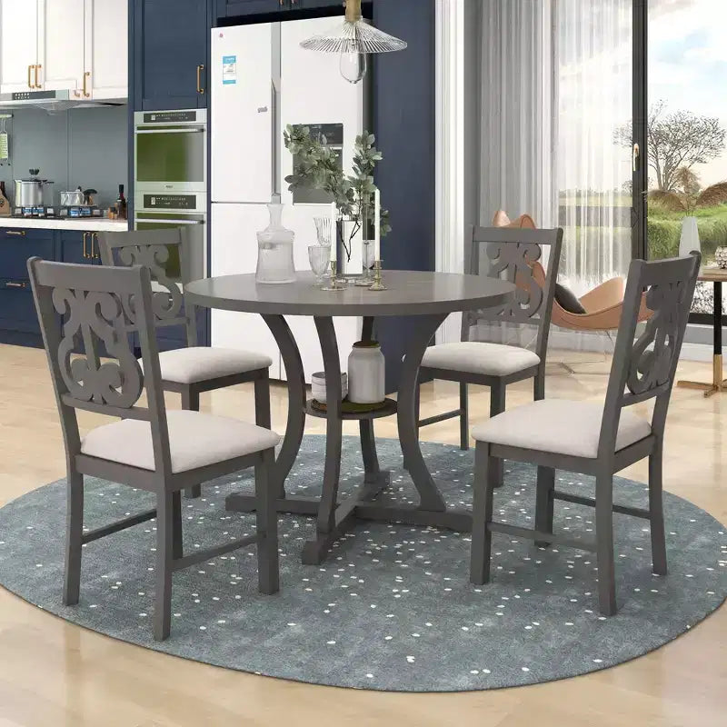 Ensemble de salle à manger rond 5 pièces en bois avec pieds de forme spéciale et dossier de chaise évidé au design exquis pour la cuisine