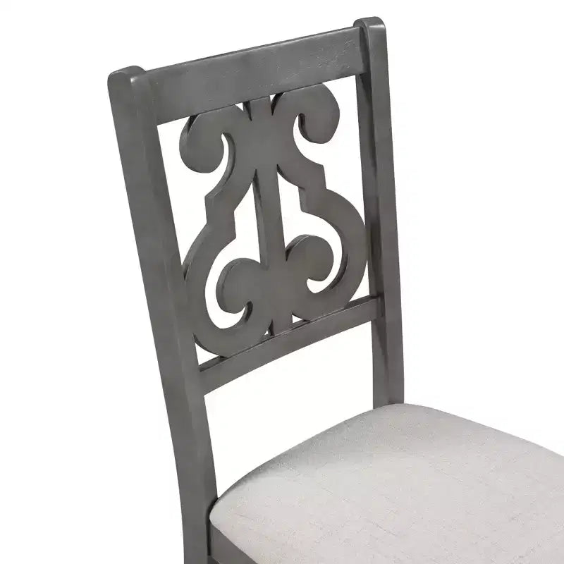 Ensemble de salle à manger rond 5 pièces en bois avec pieds de forme spéciale et dossier de chaise évidé au design exquis pour la cuisine