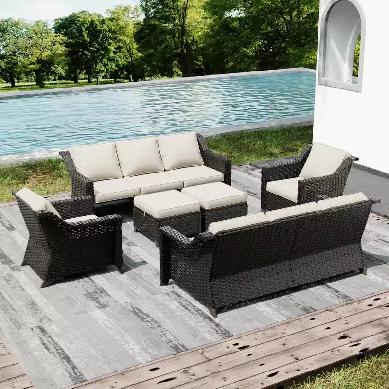 Ensemble de mobilier de jardin UPTIOT avec deux canapés, des chaises, des poufs et une table brasero pour des rassemblements spacieux