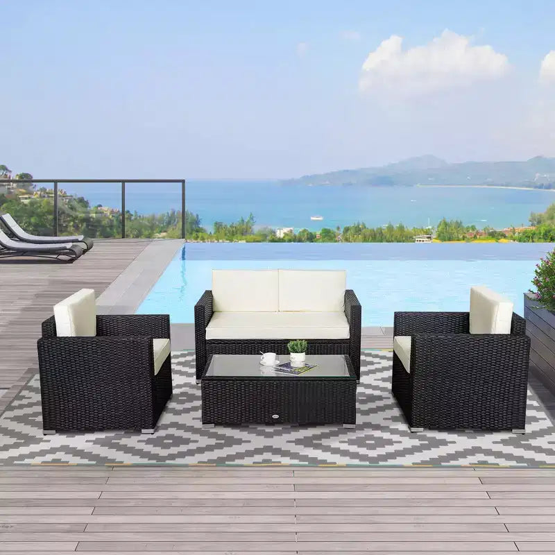 Ensemble de mobilier de jardin en rotin 4 pièces Outsunny, salon de conversation extérieur rembourré avec 2 chaises, causeuse et table basse en verre